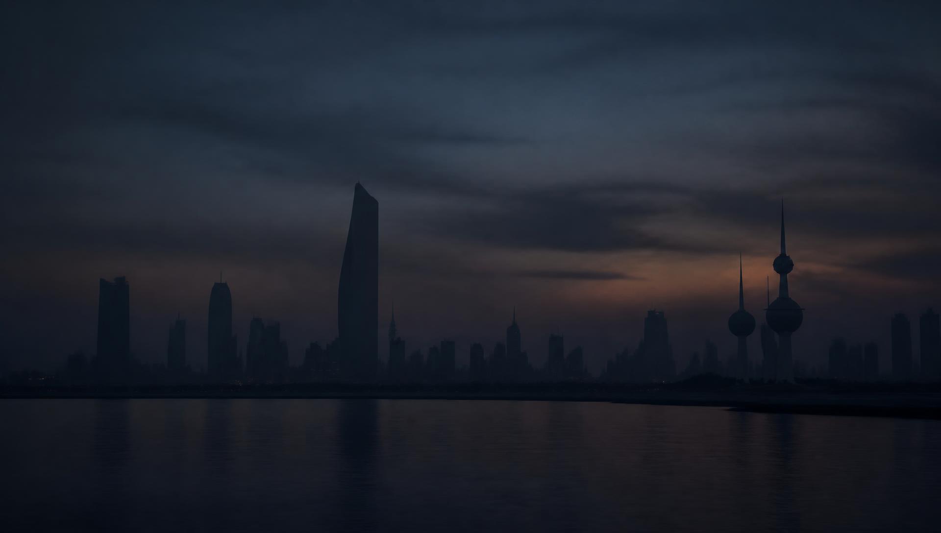 Kuwait City skyline at dusk in silhouette